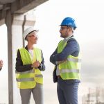 three construction site workers