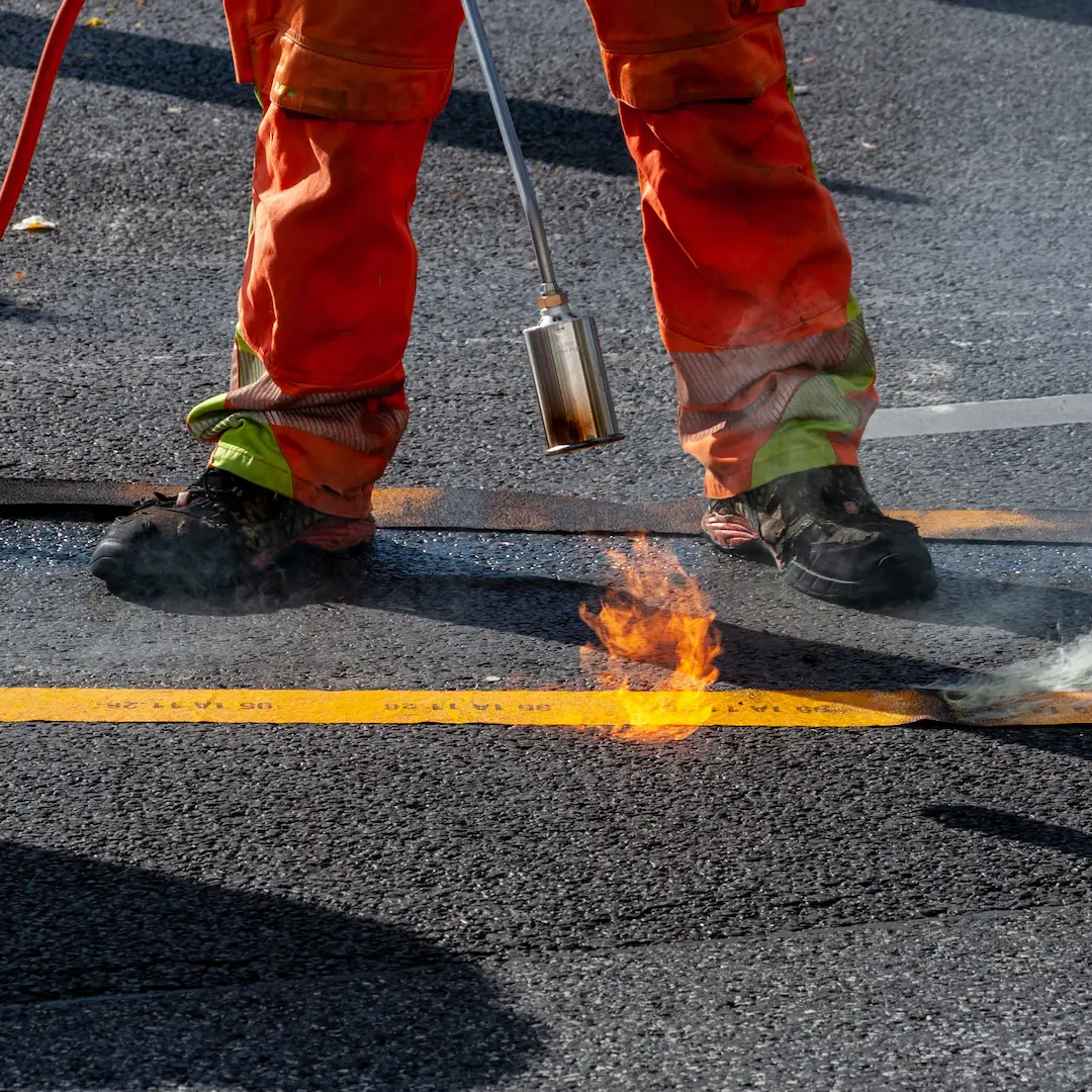 Hot works with flame on road